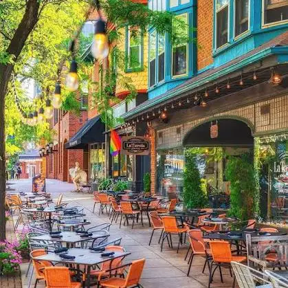 Kennett Square street scene, outdoor dining with Pride flag